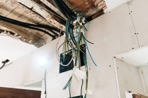 hanging electricity cables being installed in a house under renovation